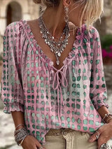 Blusa elegante con lazo al cuello y manga 3/4