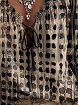 Blusa elegante con lazo al cuello y manga 3/4