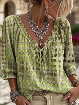 Blusa elegante con lazo al cuello y manga 3/4