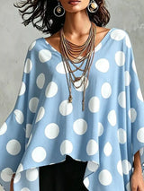 Blusa de lunares con bajo asimétrico