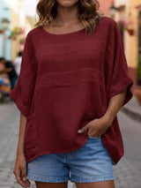 Blusa oversize de rayas con cuello redondo
