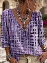 Blusa elegante con lazo al cuello y manga 3/4