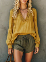 Blusa boho con cuello en V, volantes y manga larga