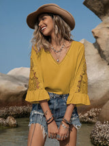 Blusa plisada con detalle de encaje y manga 3/4