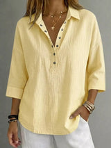 Blusa con botones a presión y manga 3/4