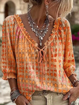 Blusa elegante con lazo al cuello y manga 3/4