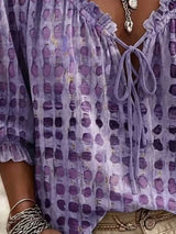 Blusa elegante con lazo al cuello y manga 3/4