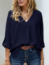 Blusa plisada elegante con cuello en V y manga larga