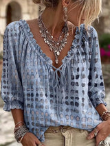 Blusa elegante con lazo al cuello y manga 3/4