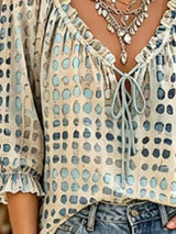 Blusa elegante con lazo al cuello y manga 3/4