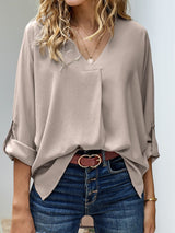 Blusa plisada elegante con cuello en V y manga larga