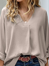 Blusa plisada elegante con cuello en V y manga larga