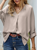 Blusa plisada elegante con cuello en V y manga larga