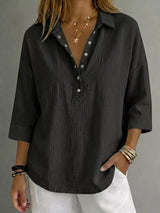 Blusa con botones a presión y manga 3/4