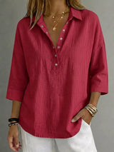 Blusa con botones a presión y manga 3/4