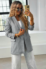 Blazer largo con bolsillos y botones en las mangas