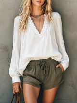 Blusa boho con cuello en V, volantes y manga larga