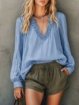 Blusa boho con cuello en V, volantes y manga larga