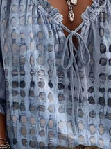 Blusa elegante con lazo al cuello y manga 3/4